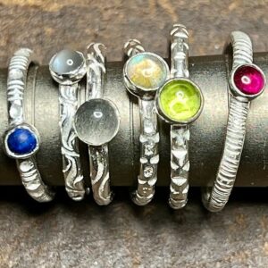 Silver spinning and stacking rings with stones made at BENCHspace silversmithing jewellery school
