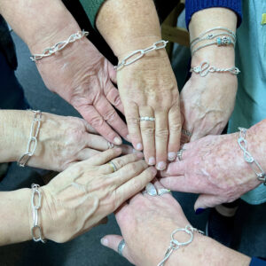 Our lovely makers with their finished bracelets.