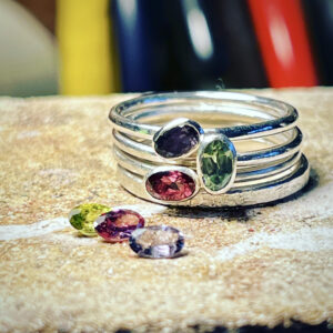 three handmade rings set with coloured sapphires in our stone setting class.